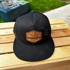 San Juan Capistrano Black Trucker Hat